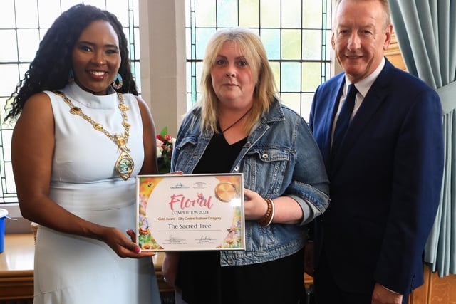 Mayor Lilian Seenoi Barr presents the City Centre Initiative Floral Competition 2024 Gold Award (City Centre Business Category) to Helen Lilley (The Sacred Tree). Included, Jim Roddy, CEO of City Centre Initiative. (Photo - Tom Heaney, nwpresspics)