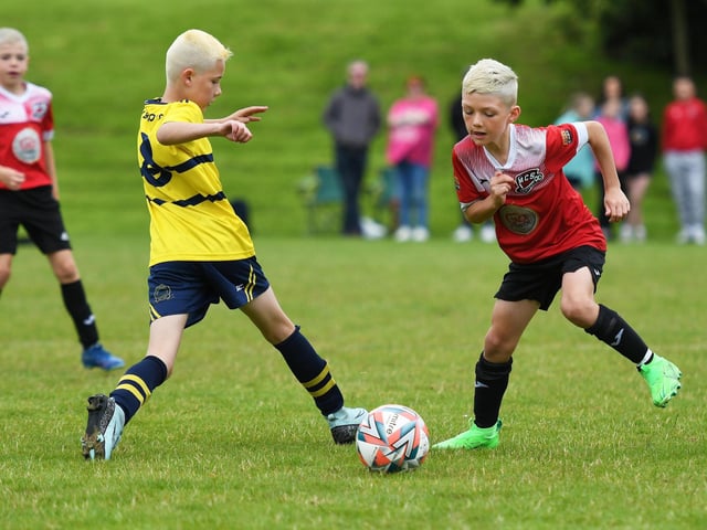 Cian Burke, Don Boscos Juniors, and Lucas Kennedy, Maiden City, tussle for the ball during their under-10's match at Oakgrove.