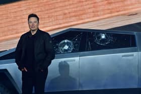 Tesla co-founder and CEO Elon Musk stands in front of the shattered windows of Tesla's Cybertruck at Tesla Design Center in Hawthorne, California on November 21, 2019. (Photo by FREDERIC J. BROWN / AFP) (Photo by FREDERIC J. BROWN/AFP via Getty Images)