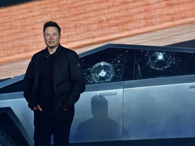 Tesla co-founder and CEO Elon Musk stands in front of the shattered windows of Tesla's Cybertruck at Tesla Design Center in Hawthorne, California on November 21, 2019. (Photo by FREDERIC J. BROWN / AFP) (Photo by FREDERIC J. BROWN/AFP via Getty Images)