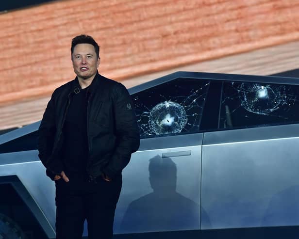 Tesla co-founder and CEO Elon Musk stands in front of the shattered windows of Tesla's Cybertruck at Tesla Design Center in Hawthorne, California on November 21, 2019. (Photo by FREDERIC J. BROWN / AFP) (Photo by FREDERIC J. BROWN/AFP via Getty Images)