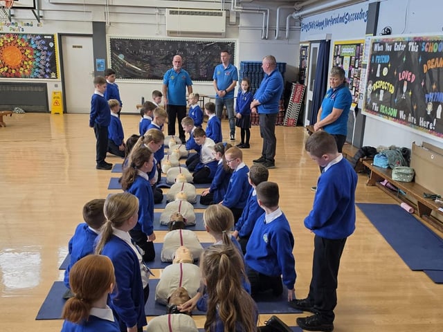 Children from St Paul's with the mannequins used in the training.