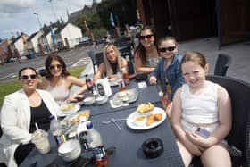 This family enjoying the food on offer at Sunday's Feile 24 event - 'Fest-Hive-Al' at the Gasyard Park, Derry.