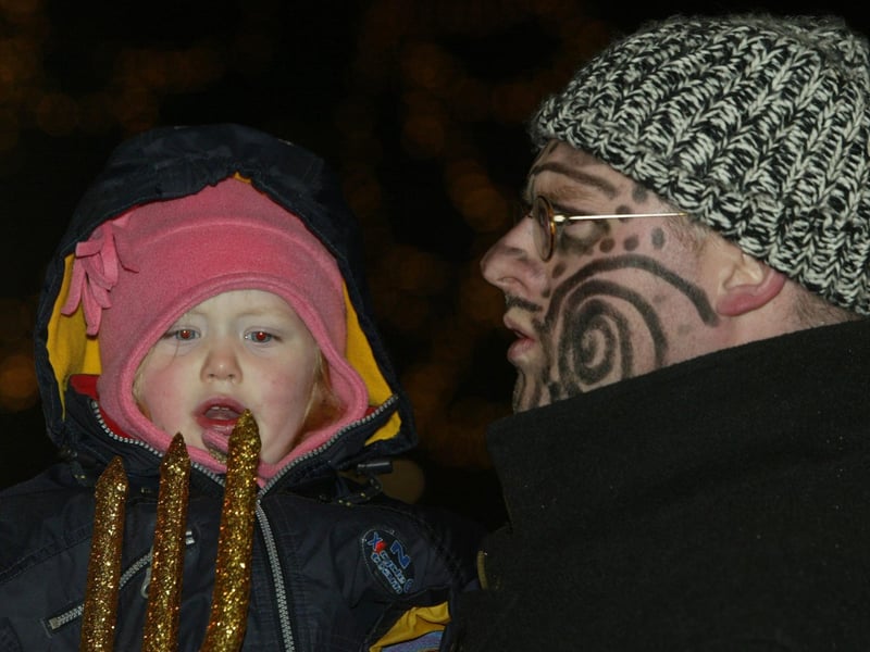 Macha Nic An Batha keeps an eye on the spear with a little help from Robbie McVeigh. (0311JB18):20 YEARS ON: Halloween celebrations in Derry in 2003