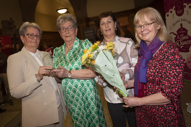 Ursula Melaugh (second from left) pictured with work colleagues and the award she received from the Mayor, Sandra Duffy on Tuesday evening at the Guildhall, Derry. From left Lou Cooke, Bernie Duncan and Carmel McGrath.