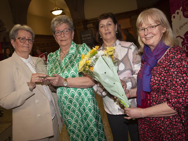 Ursula Melaugh (second from left) pictured with work colleagues and the award she received from the Mayor, Sandra Duffy on Tuesday evening at the Guildhall, Derry. From left Lou Cooke, Bernie Duncan and Carmel McGrath.