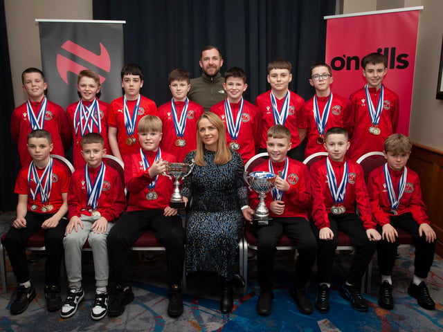 Caroline Casey, manager, O’Neills Sports Superstore, Derry presenting the League Trophy and Willie Curran Memorial Cup to winners Newell Academy 2010s at the Annual Awards in the City Hotel on Friday night last. Included is coach Sandy Gillespie. (Photos: Jim McCafferty Photography)