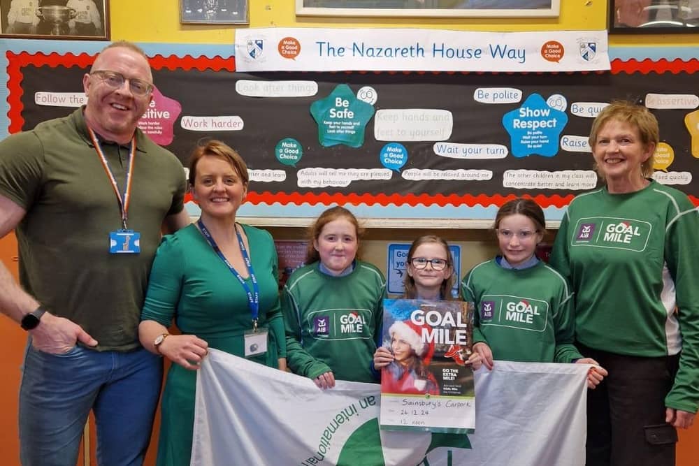 Supporters of the Derry GOAL Mile, from left to right, Kevin Holly, senior teacher, Little Oaks, Derry; Roisin Blackery, Principal of Nazareth House Primary School, Derry with Primary 7 pupils Tess, Erin and Hannah and Patti Holly, Nazareth House Primary School governor.