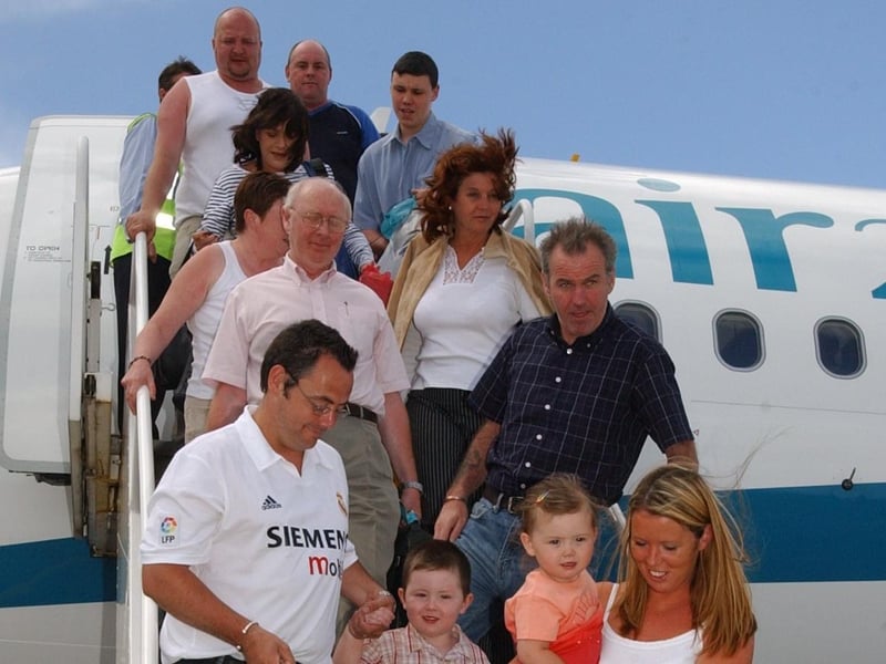 Local people on the steps of the plane at City of Derry Airport.
