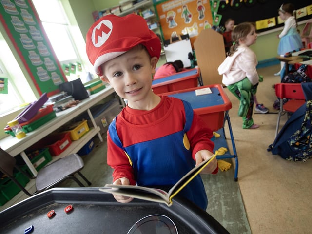 Young Charlie, a P2 pupil at Hollybush celebrates World Book Day on Thursday.