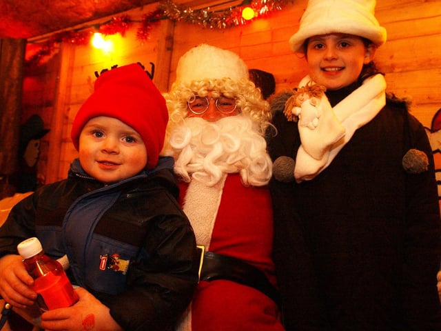 Joey and Jessica Harkin are all smiles as they meet Santa. (0612PG68) : Christmas in Inishowen in 2005.