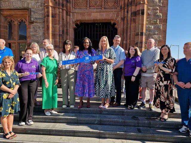 The Mayor of Derry and Strabane Lilian Seenoi-Barr with representatives of the Western Trust, Age Concern Causeway, the Public Health Agency, Derry GP Federation, DEEDS and service users at the launch of the Age Concern Causeway Dementia Wristband initiative at the Guildhall.