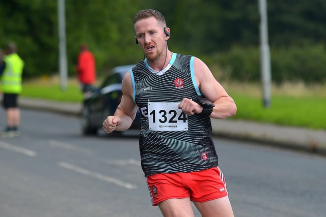 Eddie Devine competing in the Eglinton Runners charity 5K race at Campsie on Sunday morning. Photo: George Sweeney. DER2331GS - 25
