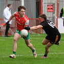 Drum’s Conor McLaughlin prepares against Colmcille’s Tiarnan McKeever last week in Celtic Park. (Photo: Tom Heaney)