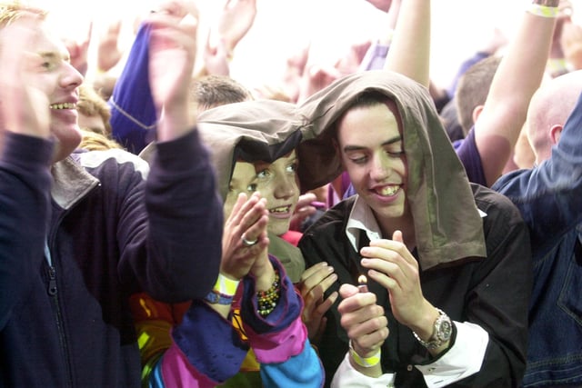 Fans enjoying the Oasis and Ocean Colour Scene concert in September 2002.