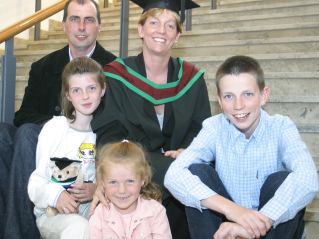 Patricia Jennings who received her MSC in Computer Information Systems pictured with her husband Paul and children Christian Rachel and Steven. (1107JB41)