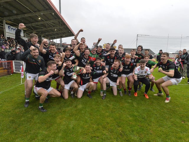 Slaughtmanus players and fans celebrate winning the Derry Junior Football Championship Joe Brolly Cup after defeating Doire Trasna, in Celtic Park, on Sunday afternoon. Photo: George Sweeney