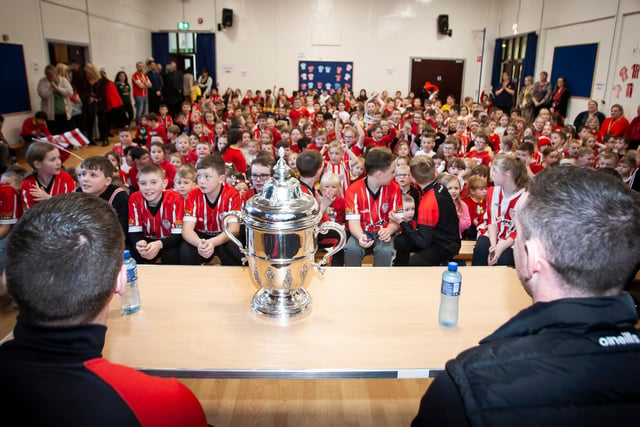 A fantastic reception for Shane and Patrick McEleney as they take their seats with the FAI Cup at Steelstown PS last week.