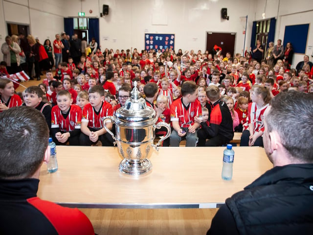 A fantastic reception for Shane and Patrick McEleney as they take their seats with the FAI Cup at Steelstown PS last week.