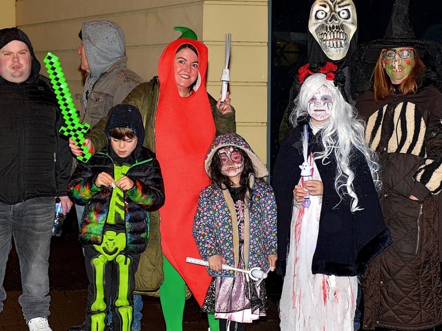 Spectators line the route of the Halloween carnival parade ‘On the Ninth Wave’ on Monday evening. Photo: George Sweeney.  DER2244GS – 076