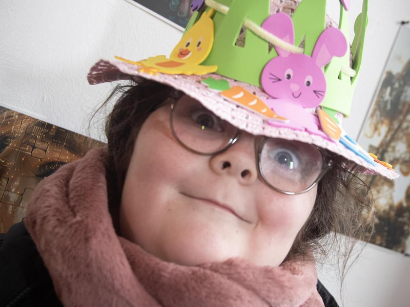CRACKER BONNET!. . . .Long Tower pupil Anna Marie McIntyre proudly displays her Easter bonnet.