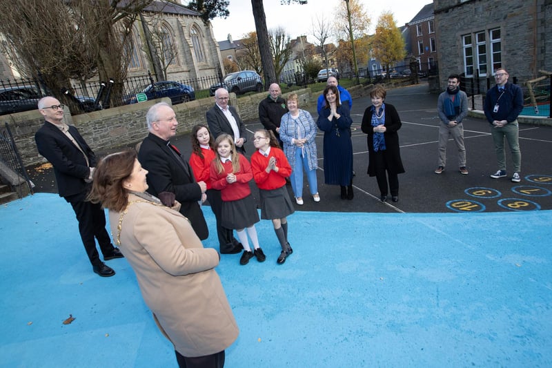Bishop Donal McKeown blesses the new playground at St. Eugene's PS on Monday.