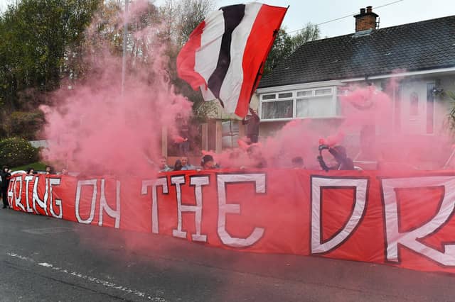 Derry City fans at the Brandywell Stadium on Saturday morning prior to the team’s departure for Dublin ahead of Sunday’s FAI Cup Final against Drogheda United. Photograph: George Sweeney