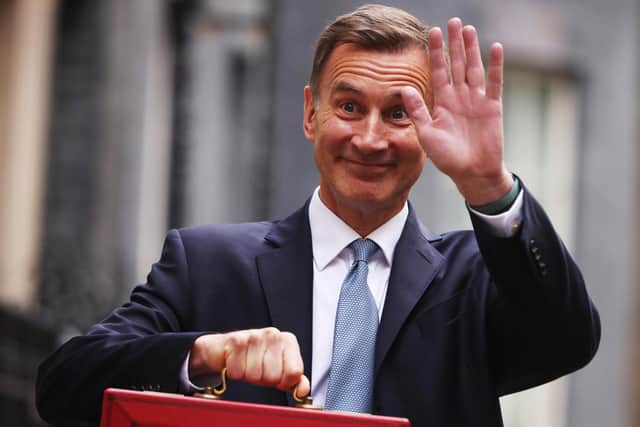 LONDON, ENGLAND - MARCH 15: UK Chancellor Jeremy Hunt leaves Downing Street with the despatch box to present his spring budget to parliament on March 15, 2023 in London, England. Highlights of the 2023 budget are an increase in the tax-free allowance for pensions which the Chancellor hopes will stem the number of people taking retirement, a package of help for swimming pools affected by the increase in energy bills and changes to childcare support for parents on universal credit. (Photo by Dan Kitwood/Getty Images)
