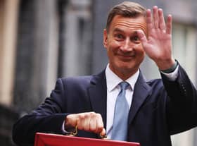 LONDON, ENGLAND - MARCH 15: UK Chancellor Jeremy Hunt leaves Downing Street with the despatch box to present his spring budget to parliament on March 15, 2023 in London, England. Highlights of the 2023 budget are an increase in the tax-free allowance for pensions which the Chancellor hopes will stem the number of people taking retirement, a package of help for swimming pools affected by the increase in energy bills and changes to childcare support for parents on universal credit. (Photo by Dan Kitwood/Getty Images)