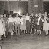 Dancing together at the St Eugene's Parish Senior Citizens Party in the parish hall.