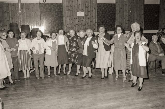 Dancing together at the St Eugene's Parish Senior Citizens Party in the parish hall.