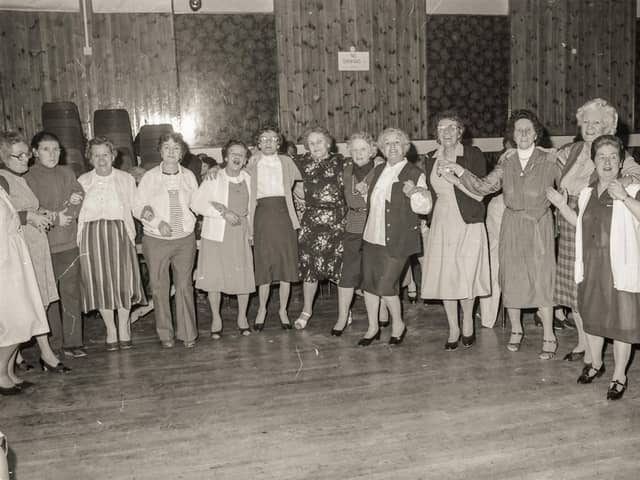 Dancing together at the St Eugene's Parish Senior Citizens Party in the parish hall.