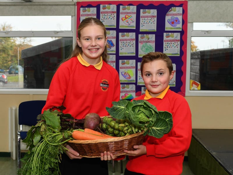 Ballougry Primary School pupils Chloe (P7) and Danny (P6) pictured at the Harvest Assembly and Food Bank held in the school on Wednesday morning. Photo: George Sweeney