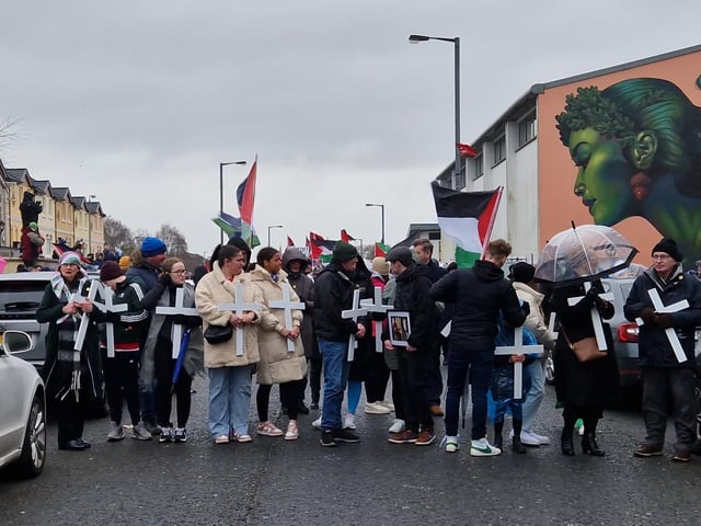 White crosses carried at the front of the march in Derry.