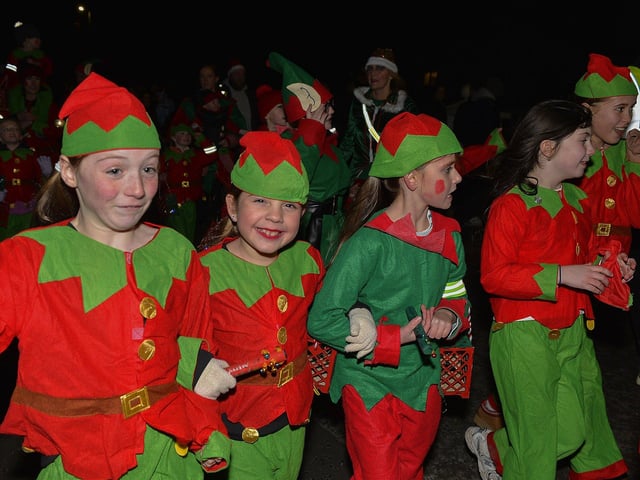 Culmore Community Partnership Elf Parade makes its way towards the Community Hub on Friday night. Photo: George Sweeney