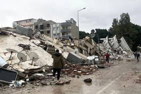 Collapsed buildings and devastation following the earthquake.