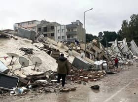 Collapsed buildings and devastation following the earthquake.