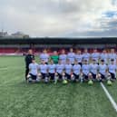 Manager Marty McCann (left) with his Ulster University Magee side who defeated Southwest College, at the Ryan McBride Brandywell Stadium.