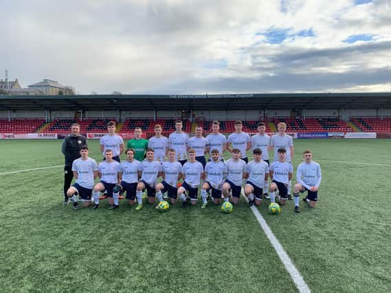 Manager Marty McCann (left) with his Ulster University Magee side who defeated Southwest College, at the Ryan McBride Brandywell Stadium.