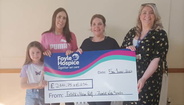 Ellie, Helen and Emma Relf presenting a cheque to Ailbhe McDaid, proceeds from a Sponsored Zumbathon held recently in memory of their Grandma Sally Relf.
