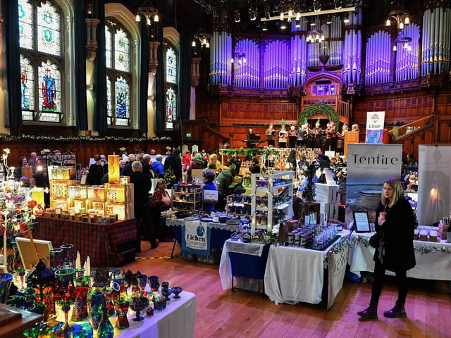 People browse the large range of gifts at the Guildhall Christmas Fair on Friday afternoon. Photo: George Sweeney / Derry Journal