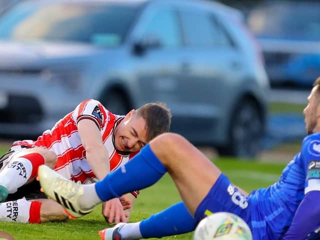 Daniel Kelly is brought down inside the penalty area by Robbie McCourt in Waterford. Mandatory Credit: Kevin Moore/MCI