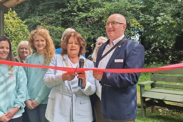 Cutting the ribbon at the official opening of the Garden of Angles in St Columb's Park
