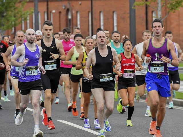 First Wave runners in the Waterside Half Marathon make their way out of Ebrington Square towards Limavady Road. Photo: George Sweeney
