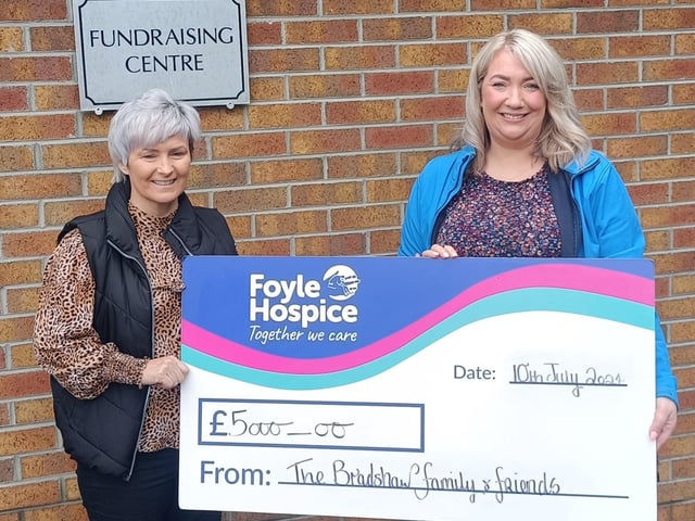 Amanda Bradshaw presenting Ailbhe McDaid, Community Fundraiser, Foyle Hospice, with a cheque for £5000. Family and friends took part in the Stairway to Heaven walk in memory of Amanda’s late son Calvin and to celebrate his birthday.