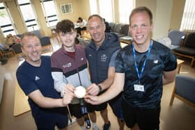 A visit to the staff room where Sam proudly showed off his London Marathon medal to PE teachers Mr. Michael McLaughlin, Mr. Ciaran Stevenson and Mr. James Green. (Photos: Jim McCafferty Photography)