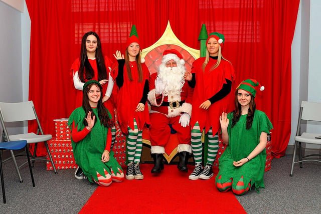 Santa and his helpers at the Christmas Craft Fair held in the Galliagh Community Centre on Saturday afternoon. Photo: George Sweeney. DER2250GS – 80