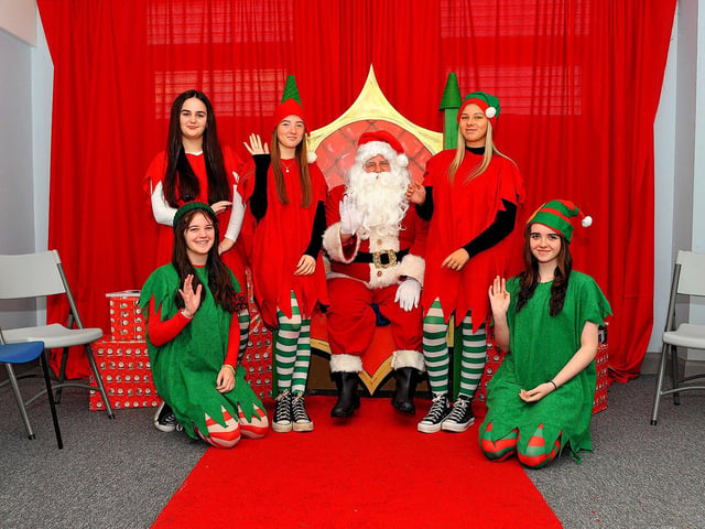 Santa and his helpers at the Christmas Craft Fair held in the Galliagh Community Centre on Saturday afternoon. Photo: George Sweeney. DER2250GS – 80