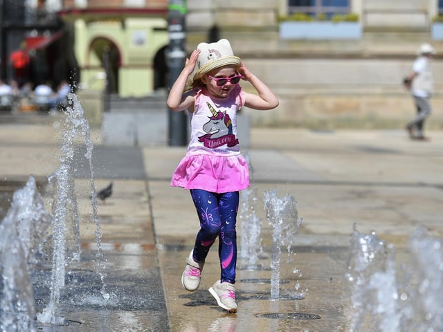 Five-year-old Derry girl Billie – Rose McKinney playing at the water fountains in Guildhall Square. Photo: George Sweeney