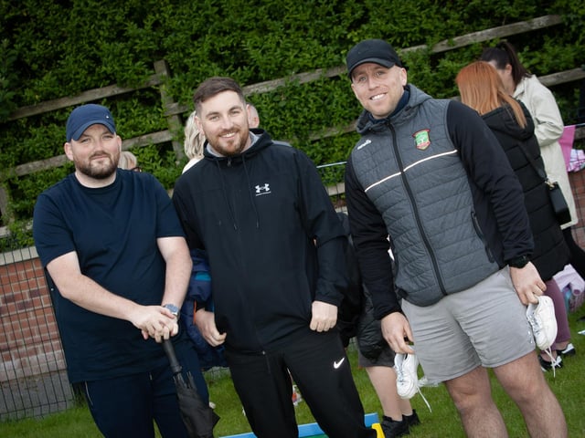 DADS R US!. . . .Some of the dadds take time out to pose for a photo at Friday's Holy Child PS Summer Fair.